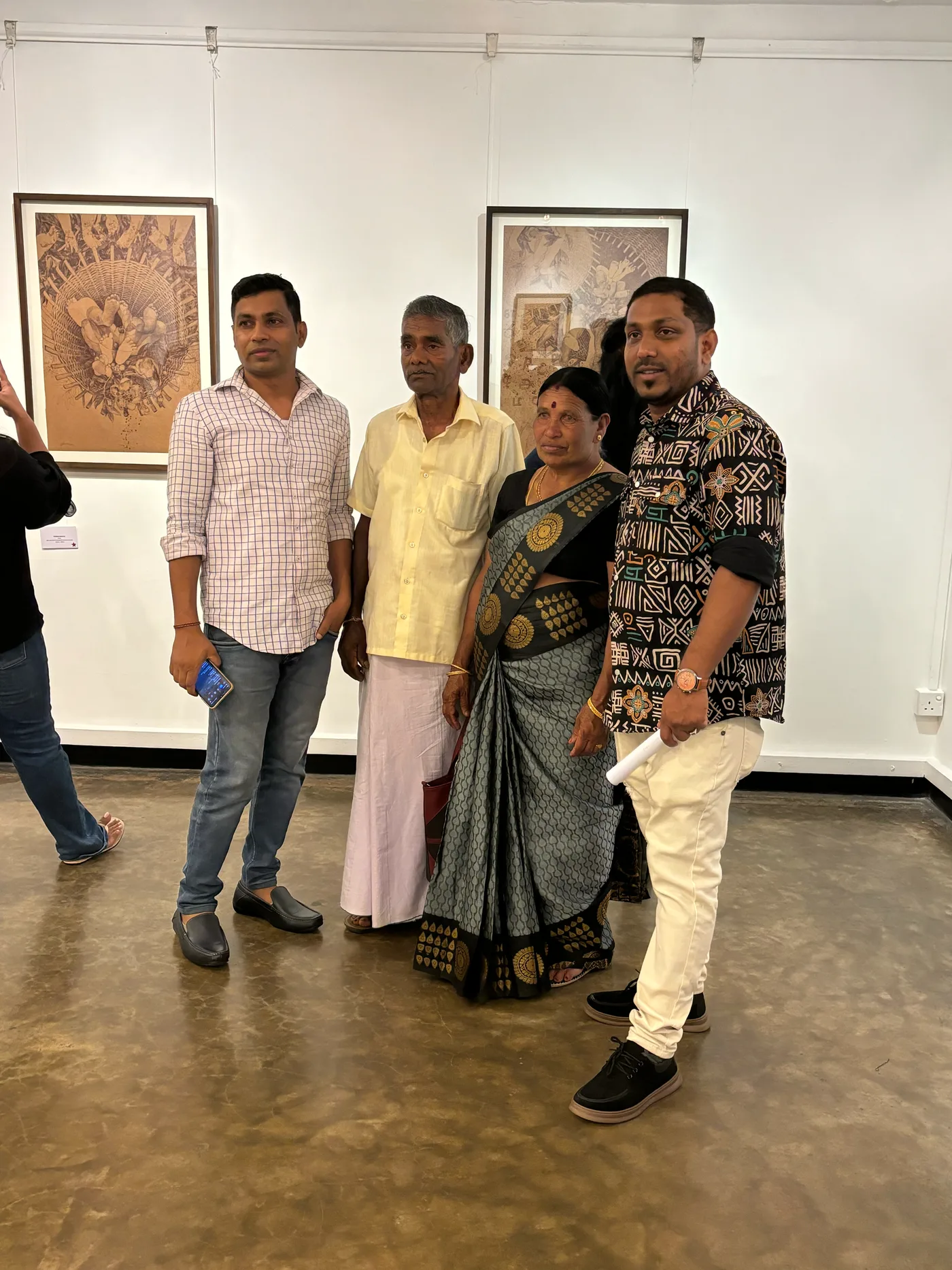 Arulraj Ulaganathan with his family at the exhibition opening.