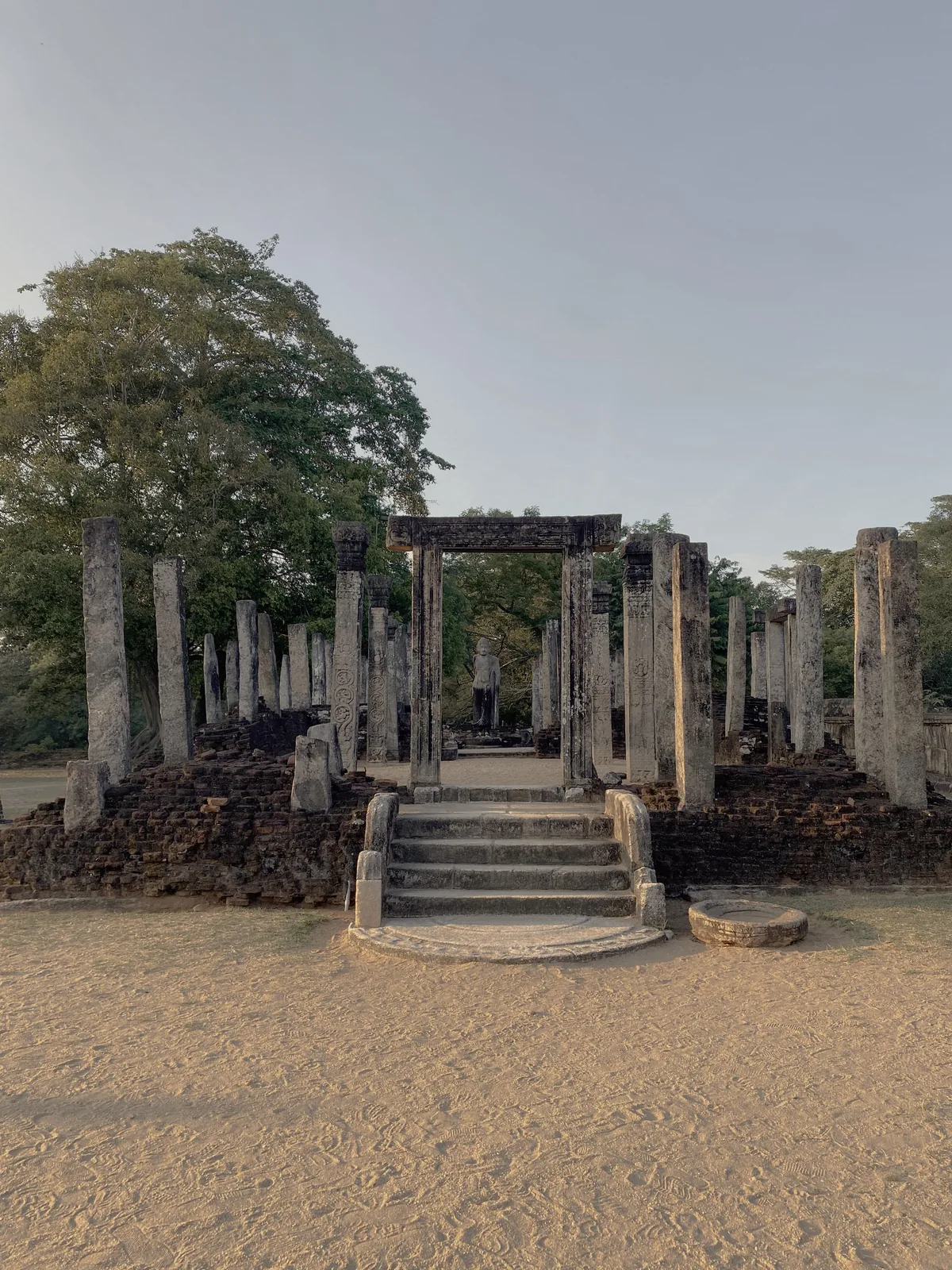 A makara balustrade at the Polonnaruwa Vatadage, the end of a staircase carved as a scrolling makara water-beast.