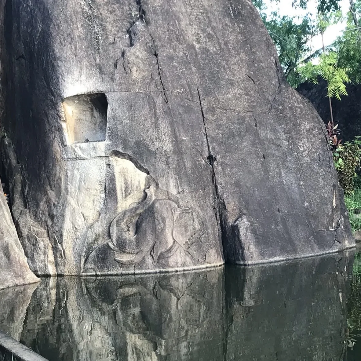 The Isurumuniya elephant relief, elephants carved in low relief on a boulder above the temple pool.