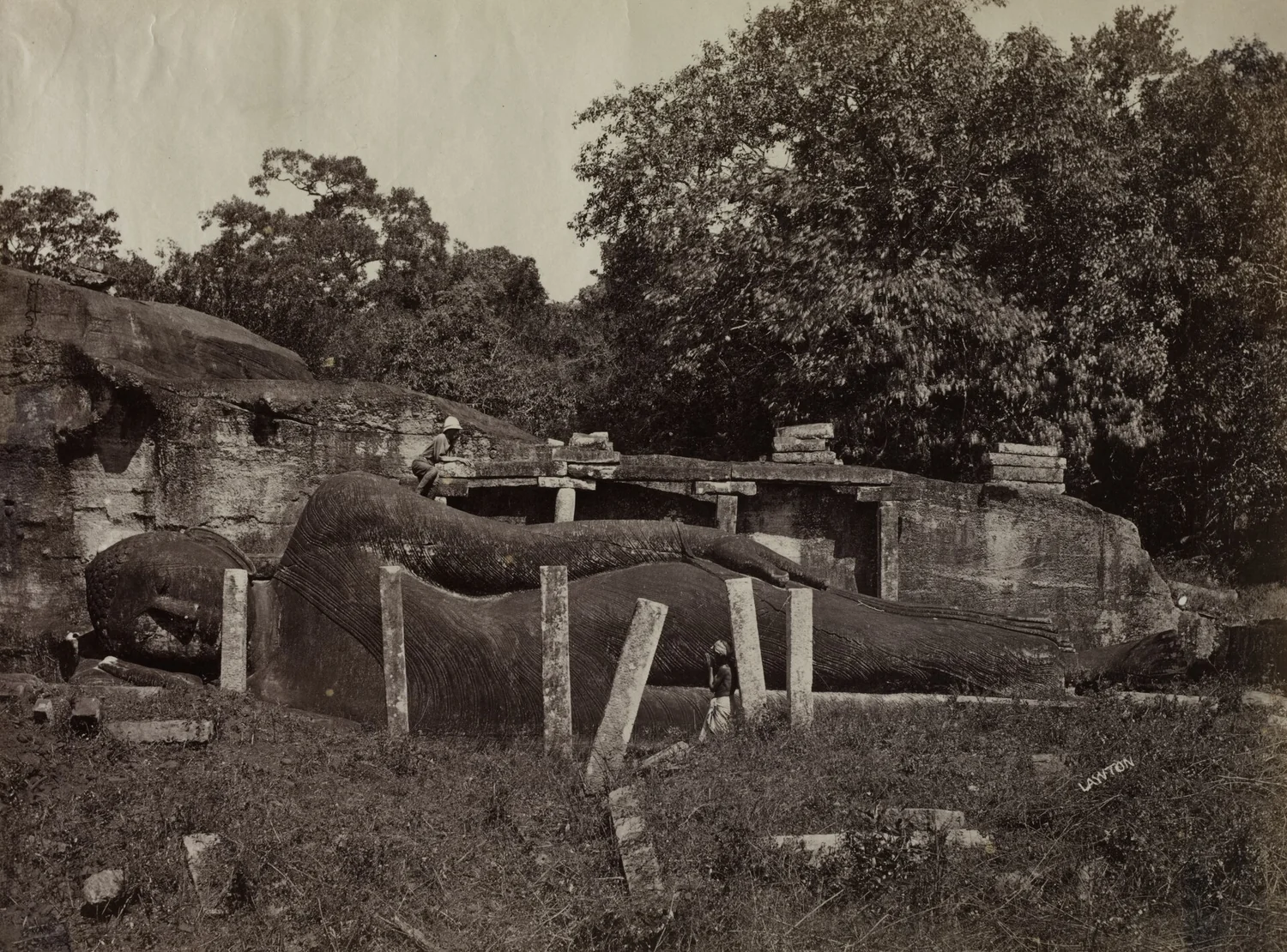 Lawton's 1870s albumen photograph of the recumbent Buddha carved from rock at Gal Vihara, Polonnaruwa.