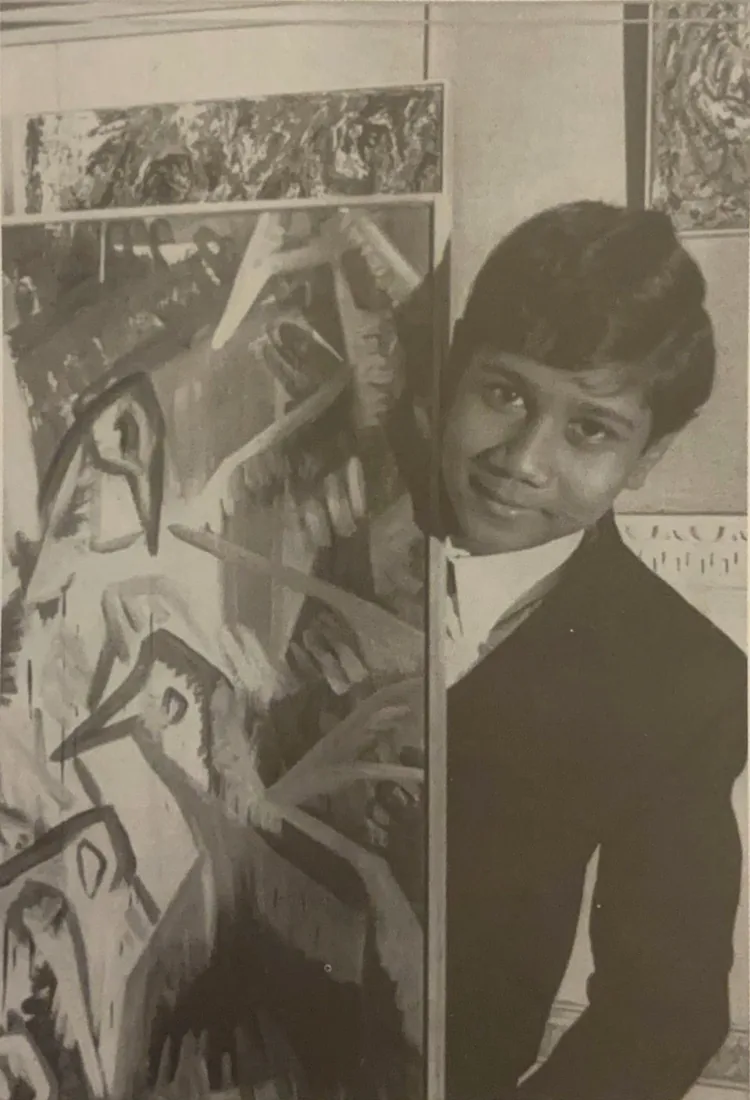 Archival photograph of the young Senaka Senanayake before a large painting, 1967.