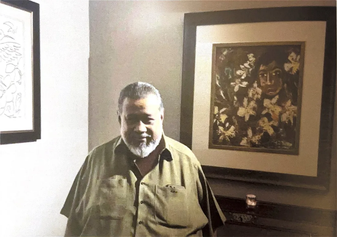 Senaka Senanayake standing before his painting 'Girl with Flowers', 1967.