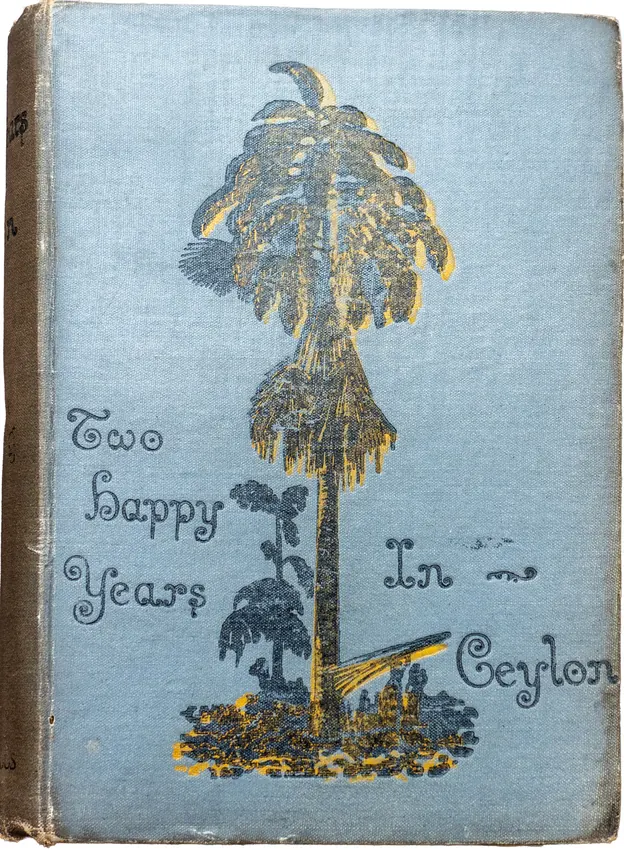 The blue cloth cover of Two Happy Years in Ceylon, decorated with a gilt palm tree.