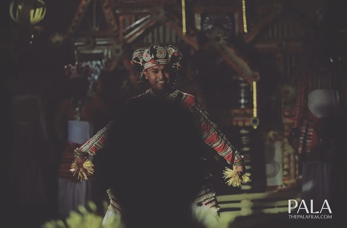 A traditional healer in the midst of a thovil, from the film Pala