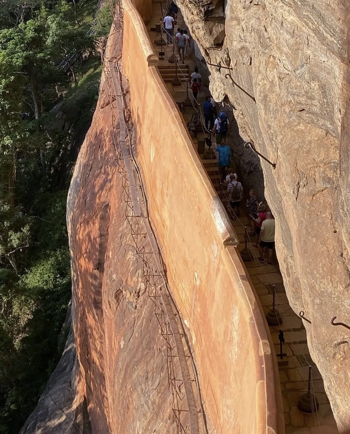 The gallery path along the sheer western face of the Sigiriya rock, beside the polished Mirror Wall.