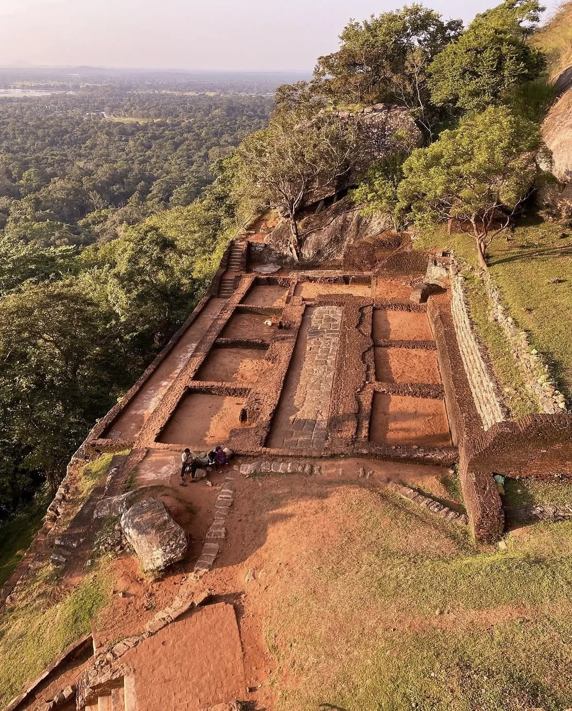 The ruined foundations of Kashyapa's palace on the summit of Sigiriya, with the plain beyond.